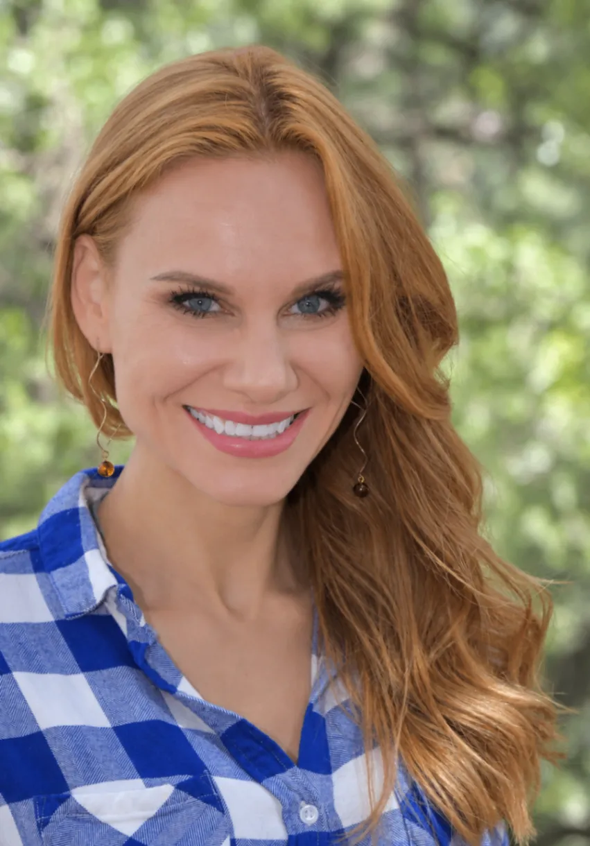 Kristina Cat, REALTOR® and attorney, smiling outdoors